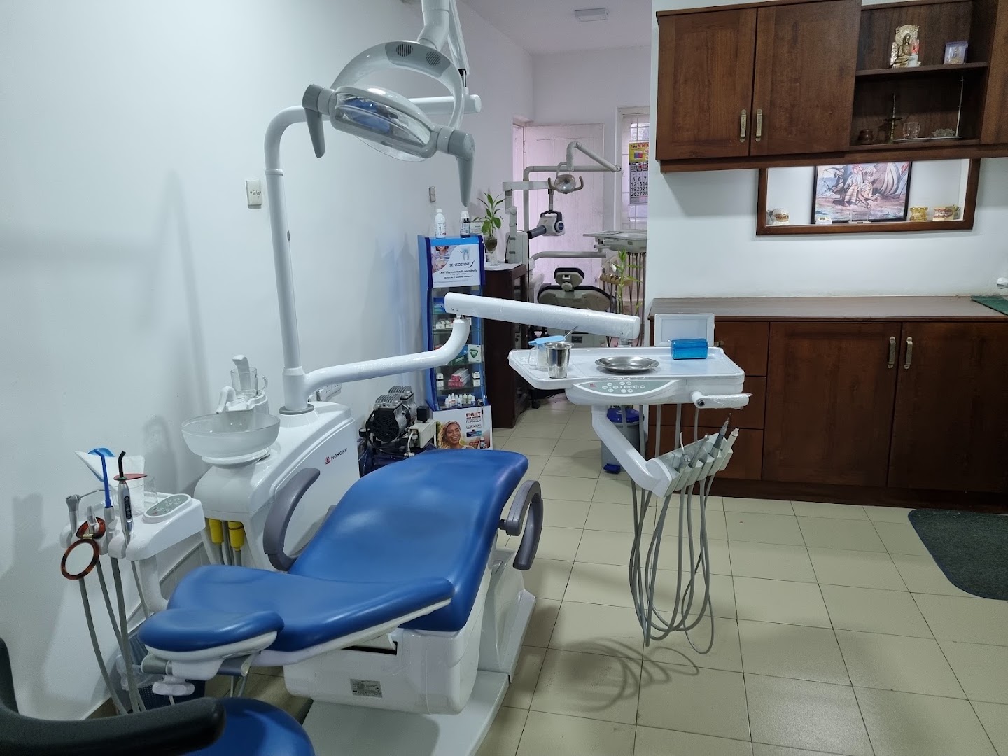 Blue dental chair and treatment equipment inside the clinic